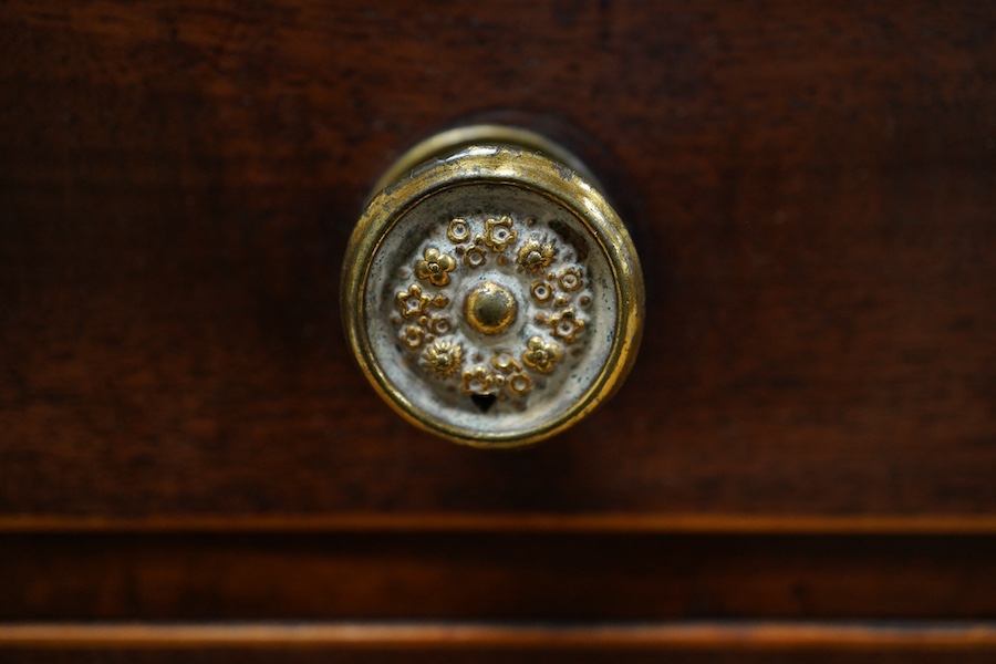 An early 20th century mahogany miniature chest of drawers, 39cm tall. Condition - one piece detached